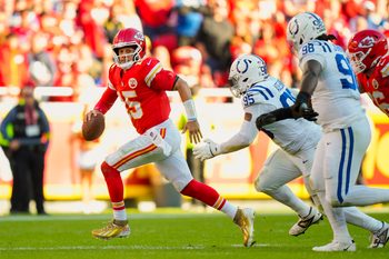 Nov 23, 2025; Kansas City, Missouri, USA; Kansas City Chiefs quarterback Patrick Mahomes (15) scrambles against Indianapolis Colts defensive tackle Adetomiwa Adebawore (95) during the second half at GEHA Field at Arrowhead Stadium. Mandatory Credit: Jay Biggerstaff-Imagn Images