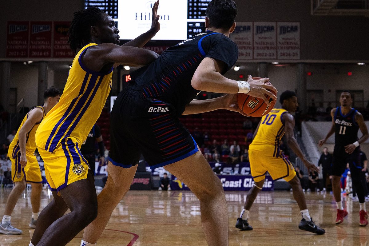 LSU's Mike Nwoko (1) defends DePaul's Fabián Flores (15) during the Emerald Coast Classic championship at Raider Arena in Niceville, Fla., Nov. 29, 2025. The Tigers won the contest 96-63. (Tyler Orsburn/News Herald)
