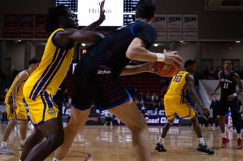 LSU's Mike Nwoko (1) defends DePaul's Fabián Flores (15) during the Emerald Coast Classic championship at Raider Arena in Niceville, Fla., Nov. 29, 2025. The Tigers won the contest 96-63. (Tyler Orsburn/News Herald)