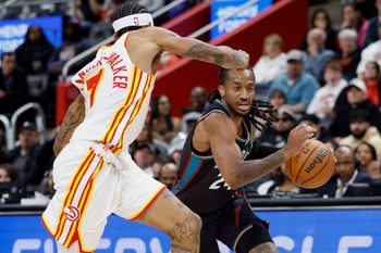 Dec 1, 2025; Detroit, Michigan, USA;  Detroit Pistons guard Daniss Jenkins (24) dribbles defended by Atlanta Hawks guard Nickeil Alexander-Walker (7) in the second half at Little Caesars Arena. Mandatory Credit: Rick Osentoski-Imagn Images