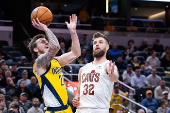 Dec 1, 2025; Indianapolis, Indiana, USA; Indiana Pacers guard Garrison Mathews (24)  shoots the ball while Cleveland Cavaliers forward Dean Wade (32) defends in the second half at Gainbridge Fieldhouse. Mandatory Credit: Trevor Ruszkowski-Imagn Images