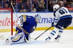 Dec 1, 2025; Buffalo, New York, USA;  Buffalo Sabres goaltender Ukko-Pekka Luukkonen (1) makes a save on Winnipeg Jets left wing Kyle Connor (81) during the third period at KeyBank Center. Mandatory Credit: Timothy T. Ludwig-Imagn Images