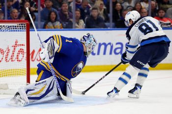 Dec 1, 2025; Buffalo, New York, USA;  Buffalo Sabres goaltender Ukko-Pekka Luukkonen (1) makes a save on Winnipeg Jets left wing Kyle Connor (81) during the third period at KeyBank Center. Mandatory Credit: Timothy T. Ludwig-Imagn Images