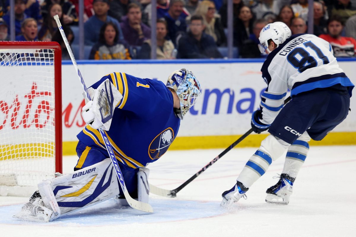 Dec 1, 2025; Buffalo, New York, USA; Buffalo Sabres goaltender Ukko-Pekka Luukkonen (1) makes a save on Winnipeg Jets left wing Kyle Connor (81) during the third period at KeyBank Center. Mandatory Credit: Timothy T. Ludwig-Imagn Images