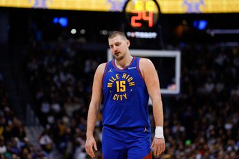 Dec 1, 2025; Denver, Colorado, USA; Denver Nuggets center Nikola Jokic (15) reacts in the fourth quarter against the Dallas Mavericks at Ball Arena. Mandatory Credit: Isaiah J. Downing-Imagn Images