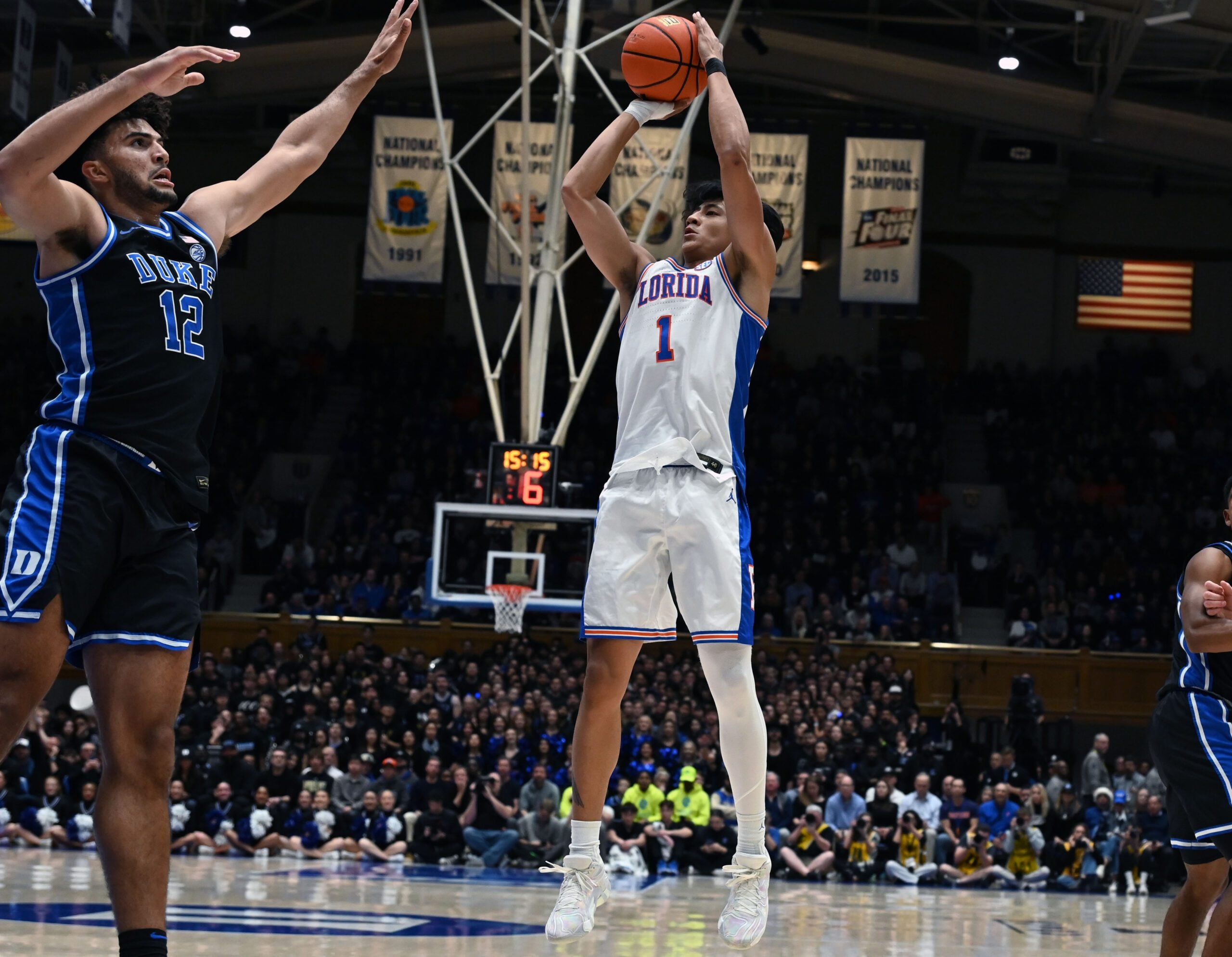 Dec 2, 2025; Durham, North Carolina, USA; Florida Gators guard Xaivian Lee (1) shoots over Duke Blue Devils forward Cameron Boozer (12) during the first half at Cameron Indoor Stadium. Mandatory Credit: Rob Kinnan-Imagn Images