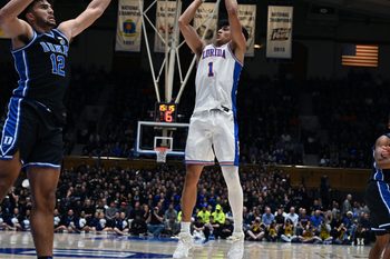 Dec 2, 2025; Durham, North Carolina, USA; Florida Gators guard Xaivian Lee (1) shoots over Duke Blue Devils forward Cameron Boozer (12) during the first half at Cameron Indoor Stadium. Mandatory Credit: Rob Kinnan-Imagn Images