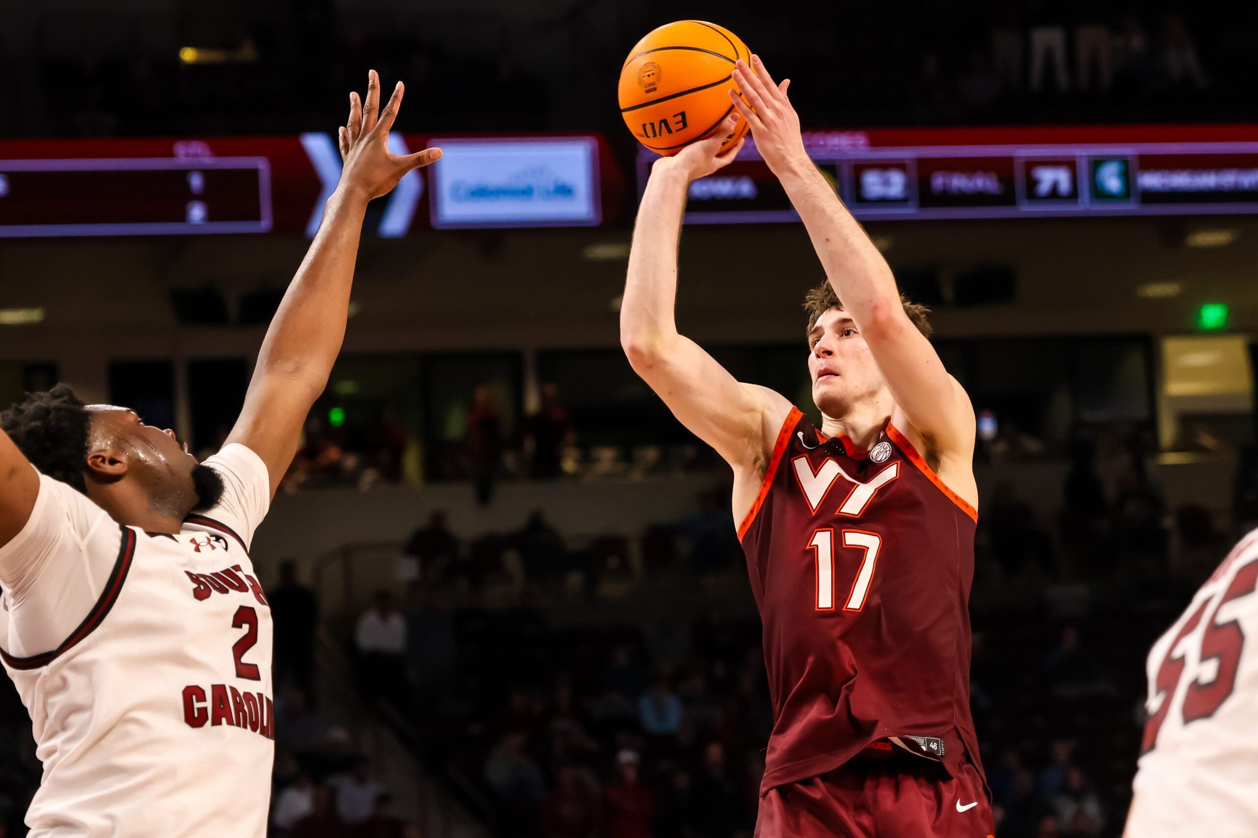 Dec 2, 2025; Columbia, South Carolina, USA; Virginia Tech Hokies guard Neoklis Avdalas (17) shoots over South Carolina Gamecocks forward Christ Essandoko (2) in the second half at Colonial Life Arena. Mandatory Credit: Jeff Blake-Imagn Images