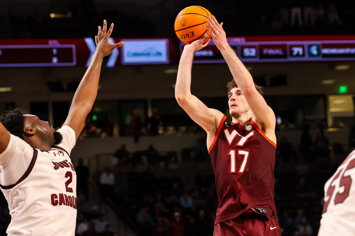 Dec 2, 2025; Columbia, South Carolina, USA; Virginia Tech Hokies guard Neoklis Avdalas (17) shoots over South Carolina Gamecocks forward Christ Essandoko (2) in the second half at Colonial Life Arena. Mandatory Credit: Jeff Blake-Imagn Images