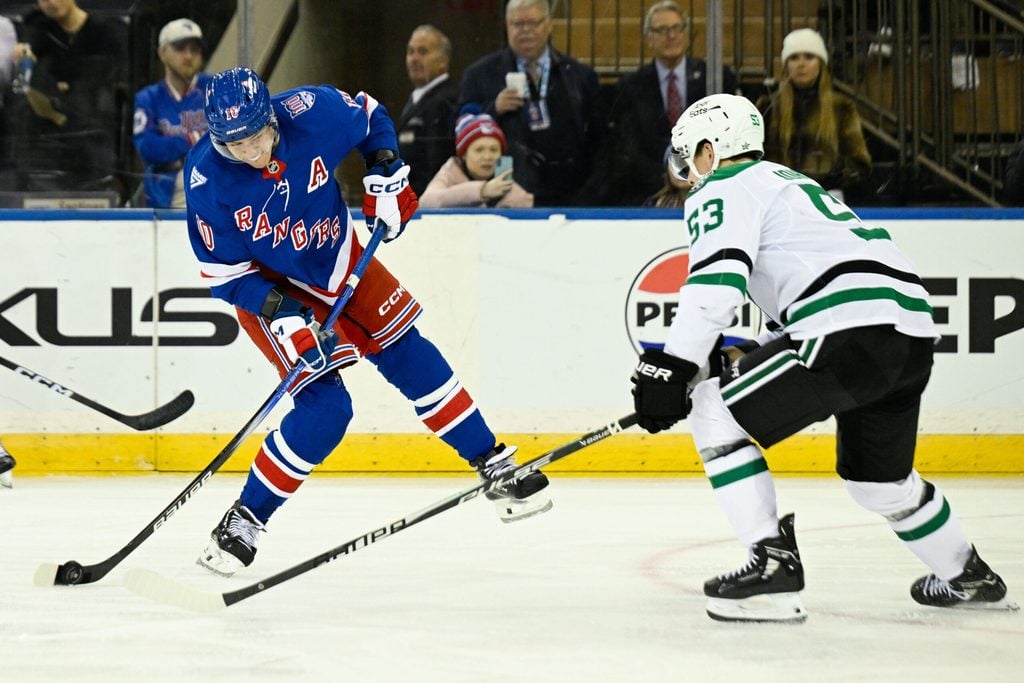 Dec 2, 2025; New York, New York, USA; New York Rangers left wing Artemi Panarin (10) attempts a shot defend by Dallas Stars center Wyatt Johnston (53) during the third period at Madison Square Garden. Mandatory Credit: Dennis Schneidler-Imagn Images