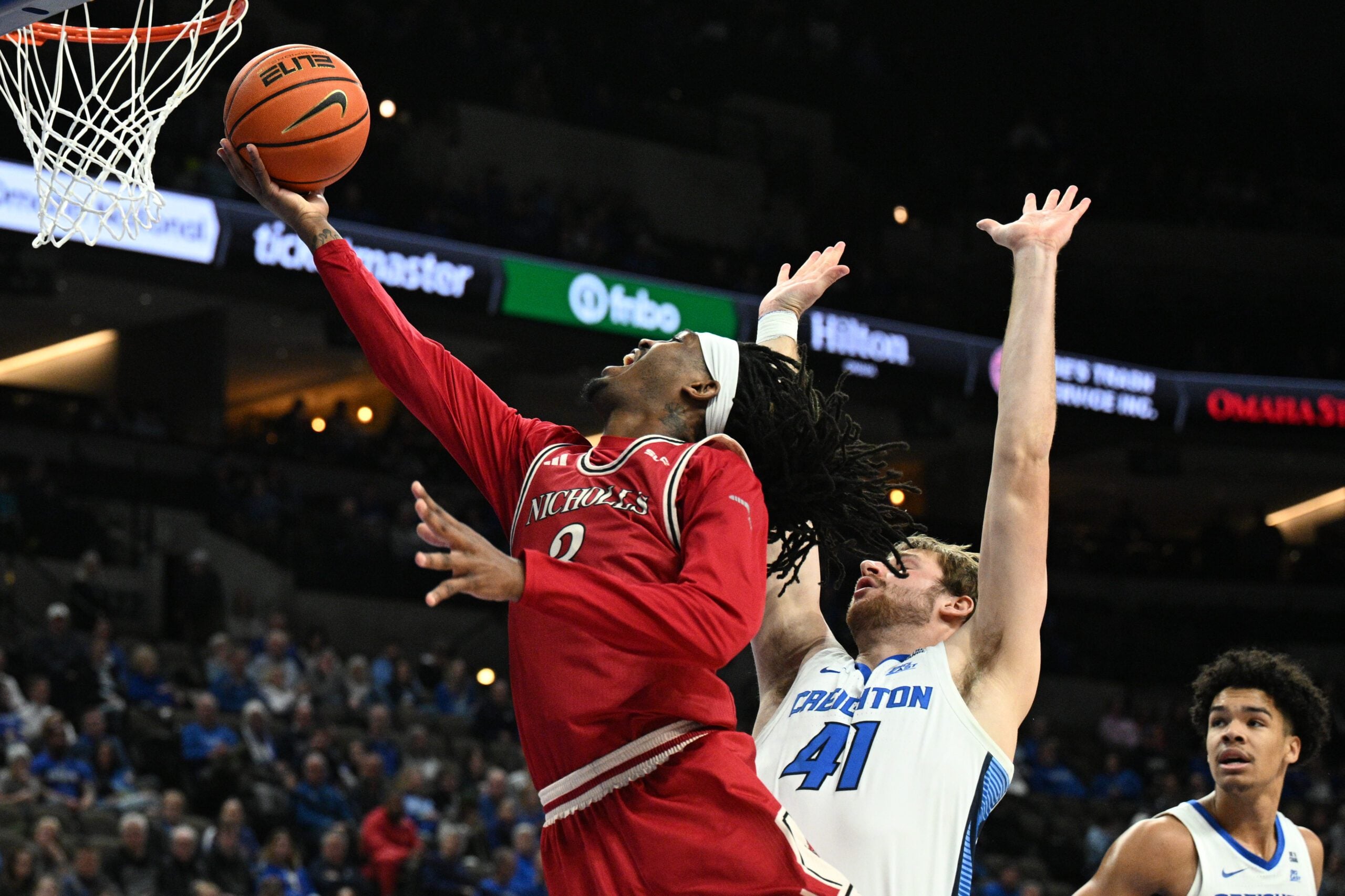 Dec 2, 2025; Omaha, Nebraska, USA;  Nicholls State Colonels forward Jaylen Searles (3) drives against Creighton Bluejays forward Isaac Traudt (41) during the first half at CHI Health Center Omaha. Mandatory Credit: Steven Branscombe-Imagn Images