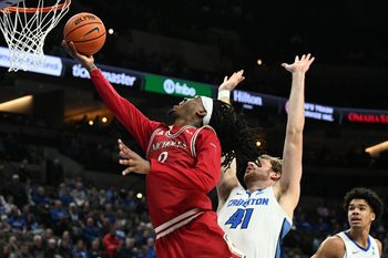 Dec 2, 2025; Omaha, Nebraska, USA;  Nicholls State Colonels forward Jaylen Searles (3) drives against Creighton Bluejays forward Isaac Traudt (41) during the first half at CHI Health Center Omaha. Mandatory Credit: Steven Branscombe-Imagn Images