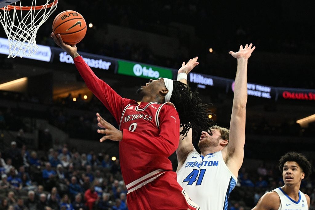 Dec 2, 2025; Omaha, Nebraska, USA; Nicholls State Colonels forward Jaylen Searles (3) drives against Creighton Bluejays forward Isaac Traudt (41) during the first half at CHI Health Center Omaha. Mandatory Credit: Steven Branscombe-Imagn Images