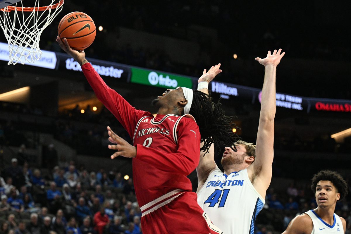 Dec 2, 2025; Omaha, Nebraska, USA; Nicholls State Colonels forward Jaylen Searles (3) drives against Creighton Bluejays forward Isaac Traudt (41) during the first half at CHI Health Center Omaha. Mandatory Credit: Steven Branscombe-Imagn Images