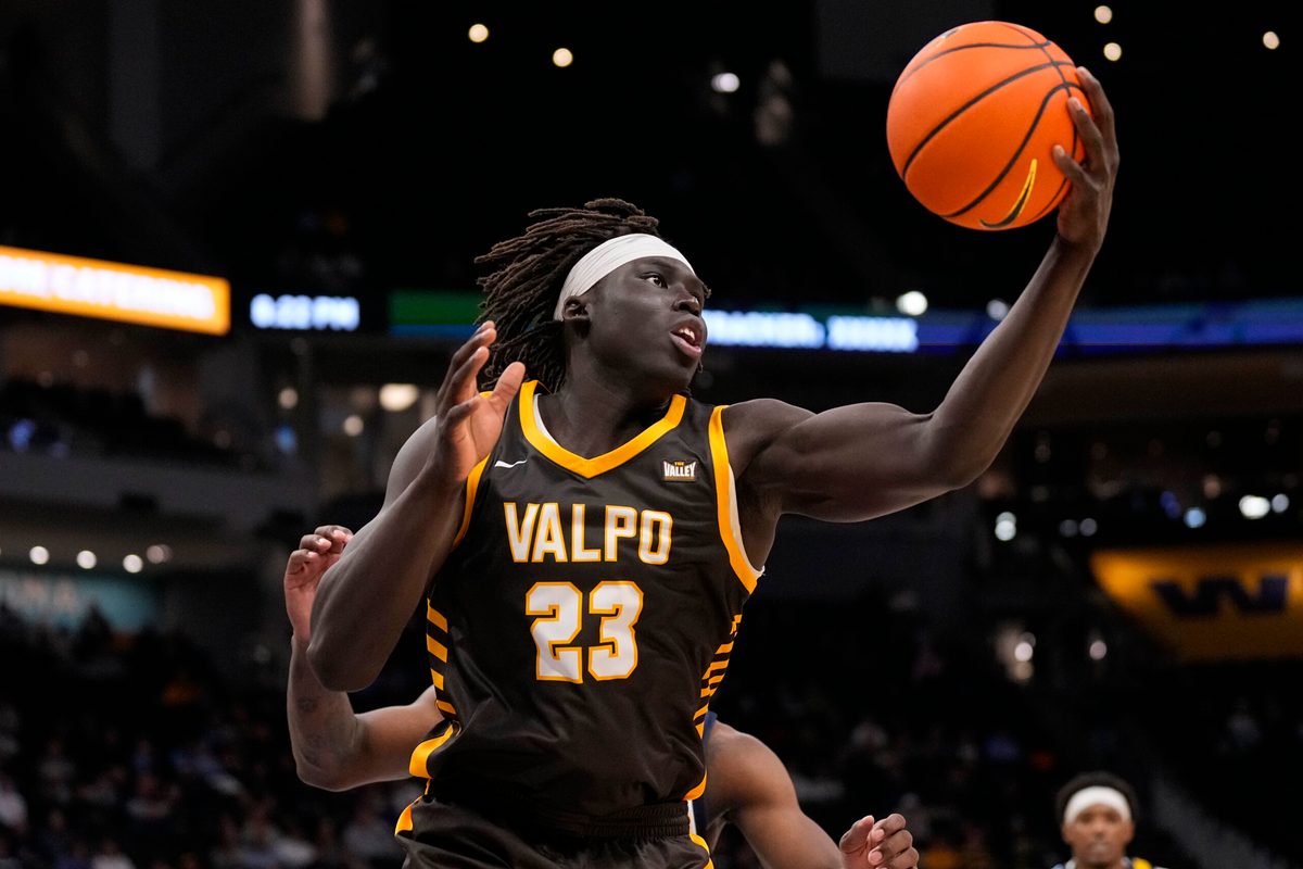 Dec 2, 2025; Milwaukee, Wisconsin, USA;  Valparaiso Beacons center Shon Tupuola (23) reaches for a rebound during the second half against the Marquette Golden Eagles at Fiserv Forum. Mandatory Credit: Jeff Hanisch-Imagn Images