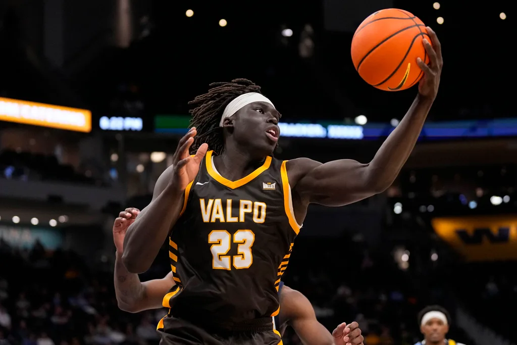 Dec 2, 2025; Milwaukee, Wisconsin, USA; Valparaiso Beacons center Shon Tupuola (23) reaches for a rebound during the second half against the Marquette Golden Eagles at Fiserv Forum. Mandatory Credit: Jeff Hanisch-Imagn Images