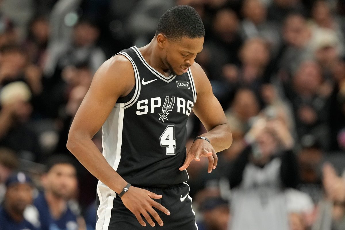 Dec 2, 2025; San Antonio, Texas, USA; San Antonio Spurs guard De’Aaron Fox (4) reacts after scoring a three point basket during the second half against the Memphis Grizzlies at Frost Bank Center. Mandatory Credit: Scott Wachter-Imagn Images
