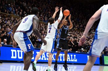 Dec 2, 2025; Durham, North Carolina, USA; Duke Blue Devils guard Caleb Foster (1) shoots over Florida Gators guard Urban Klavzar (7) during the second half at Cameron Indoor Stadium.  The Blue Devils won 67-66. Mandatory Credit: Rob Kinnan-Imagn Images
