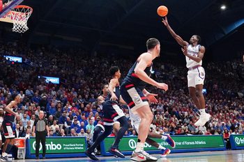 Dec 2, 2025; Lawrence, Kansas, USA; Kansas Jayhawks guard Melvin Council Jr. (14) shoots against the UConn Huskies during the second half of the game at Allen Fieldhouse. Mandatory Credit: Denny Medley-Imagn Images