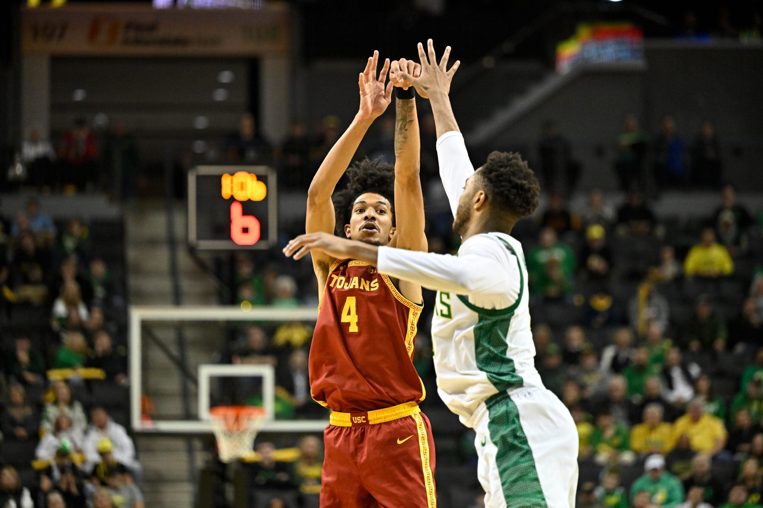Dec 2, 2025; Eugene, Oregon, USA; Southern California Trojans forward Chad Baker-Mazara (4) makes a three point basket late in the second half against the Oregon Ducks at Matthew Knight Arena. Mandatory Credit: Craig Strobeck-Imagn Images