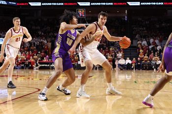 Dec 3, 2025; Ames, Iowa, USA; Alcorn State Braves guard Travis Roberts (30) defends Iowa State Cyclones forward Milan Momcilovic (22) during the first half at James H. Hilton Coliseum. Mandatory Credit: Reese Strickland-Imagn Images