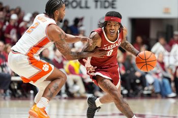 Dec 3, 2025; Tuscaloosa, AL, USA; Alabama guard Labaron Philon Jr. (0) drives against Clemson guard Dillon Hunter (2) at Coleman Coliseum. Alabama defeated Clemson 90-84. Mandatory Credit: Gary Cosby Jr.-Tuscaloosa News