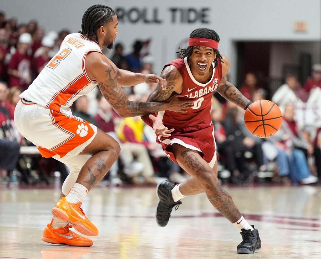 Dec 3, 2025; Tuscaloosa, AL, USA; Alabama guard Labaron Philon Jr. (0) drives against Clemson guard Dillon Hunter (2) at Coleman Coliseum. Alabama defeated Clemson 90-84. Mandatory Credit: Gary Cosby Jr.-Tuscaloosa News