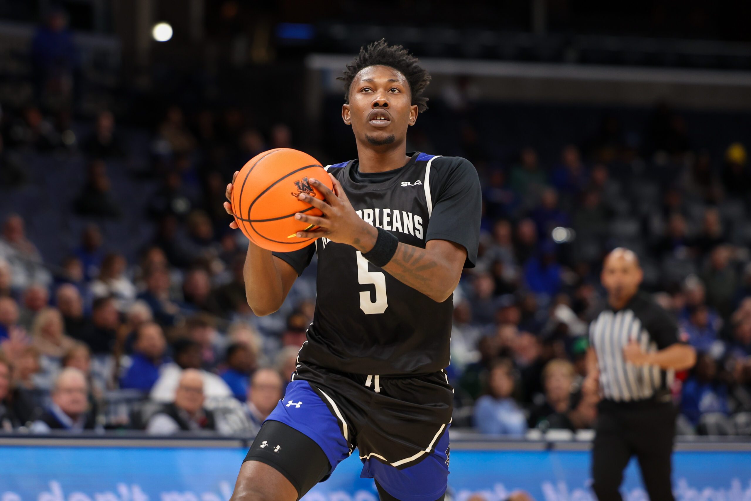 Dec 3, 2025; Memphis, Tennessee, USA; New Orleans Privateers guard Jakevion Buckley (5) handles the ball against the Memphis Tigers during the second half at FedExForum. Mandatory Credit: Wesley Hale-Imagn Images