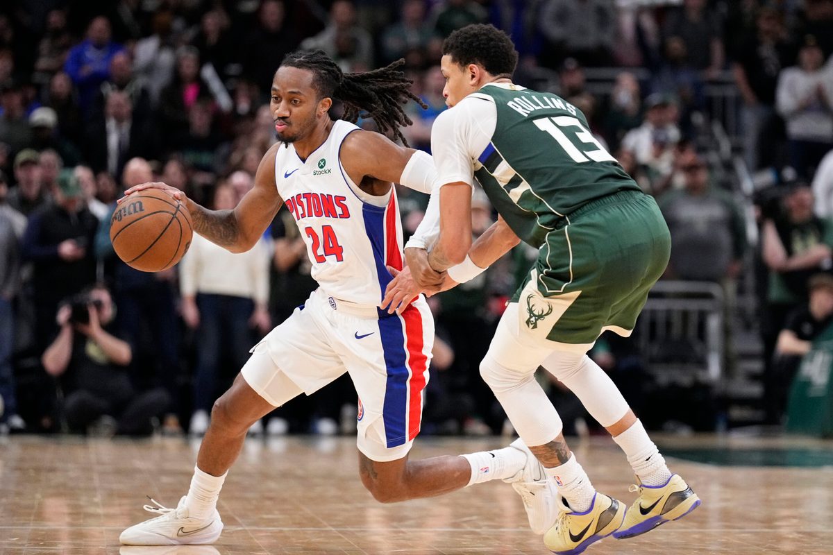 Dec 3, 2025; Milwaukee, Wisconsin, USA; Detroit Pistons guard Daniss Jenkins (24) brings the ball up the court against Milwaukee Bucks guard Ryan Rollins (13) in the second half at Fiserv Forum. Mandatory Credit: Michael McLoone-Imagn Images