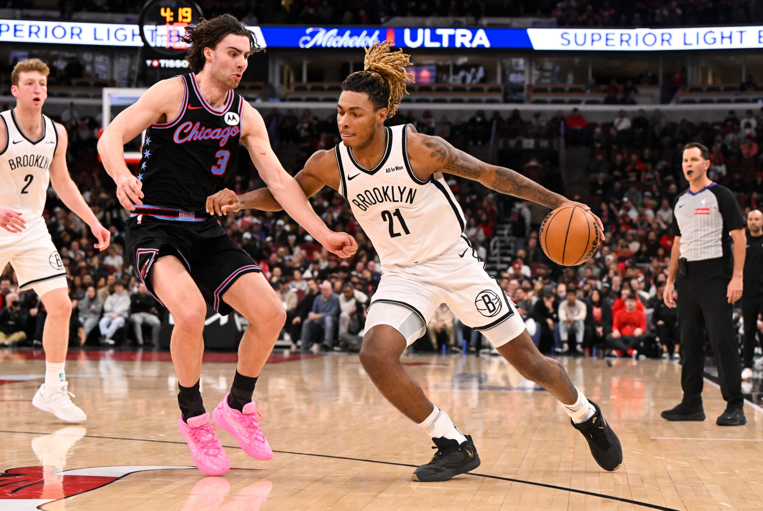 Dec 3, 2025; Chicago, Illinois, USA;  Brooklyn Nets forward Noah Clowney (21) dribbles against Chicago Bulls guard Josh Giddey (3) during the second half at the United Center. Mandatory Credit: Matt Marton-Imagn Images