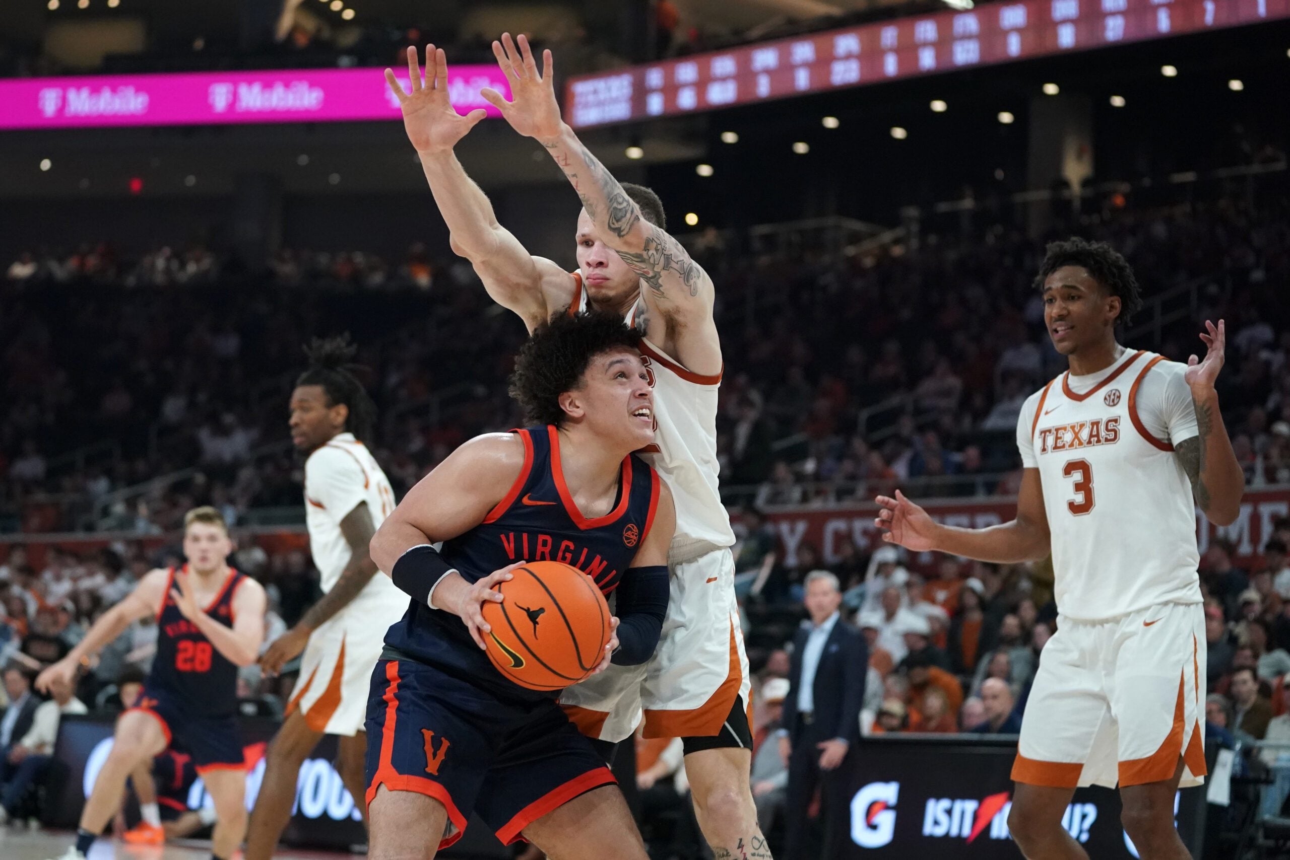 Dec 3, 2025; Austin, Texas, USA; Virginia Cavaliers guard Chance Mallory (2) shoots against Texas Longhorns guard Chendall Weaver (2) during the second half at Moody Center. Mandatory Credit: Dustin Safranek-Imagn Images
