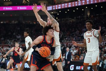 Dec 3, 2025; Austin, Texas, USA; Virginia Cavaliers guard Chance Mallory (2) shoots against Texas Longhorns guard Chendall Weaver (2) during the second half at Moody Center. Mandatory Credit: Dustin Safranek-Imagn Images