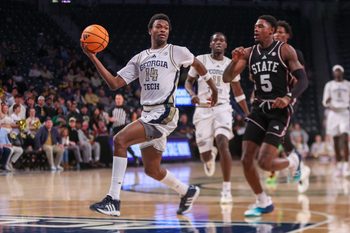 Dec 3, 2025; Atlanta, Georgia, USA; Georgia Tech Yellow Jackets forward Kowacie Reeves Jr. (14) drives past Mississippi State Bulldogs guard Shawn Jones Jr. (5) in the second half at McCamish Pavilion. Mandatory Credit: Brett Davis-Imagn Images