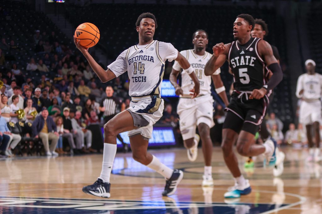 Dec 3, 2025; Atlanta, Georgia, USA; Georgia Tech Yellow Jackets forward Kowacie Reeves Jr. (14) drives past Mississippi State Bulldogs guard Shawn Jones Jr. (5) in the second half at McCamish Pavilion. Mandatory Credit: Brett Davis-Imagn Images