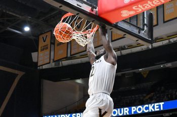 Dec 3, 2025; Nashville, Tennessee, USA;  Vanderbilt Commodores guard Duke Miles (2) dunks the ball against the Southern Methodist University Mustangs during the first half at Memorial Gymnasium. Mandatory Credit: Steve Roberts-Imagn Images