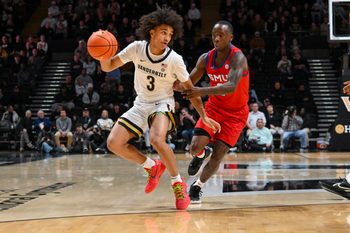 Dec 3, 2025; Nashville, Tennessee, USA;  Vanderbilt Commodores guard Tyler Tanner (3) dribbles past Southern Methodist University Mustangs guard Boopie Miller (2) during the first half at Memorial Gymnasium. Mandatory Credit: Steve Roberts-Imagn Images