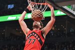Dec 4, 2025; Toronto, Ontario, CAN; Toronto Raptors forward Jameson Battle (77) dunks for a basket against the Los Angeles Lakers in the second half at Scotiabank Arena. Mandatory Credit: Dan Hamilton-Imagn Images