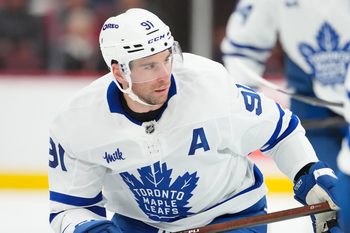 Dec 4, 2025; Raleigh, North Carolina, USA; Toronto Maple Leafs center John Tavares (91) watched the play against the Carolina Hurricanes during the third period at Lenovo Center. Mandatory Credit: James Guillory-Imagn Images