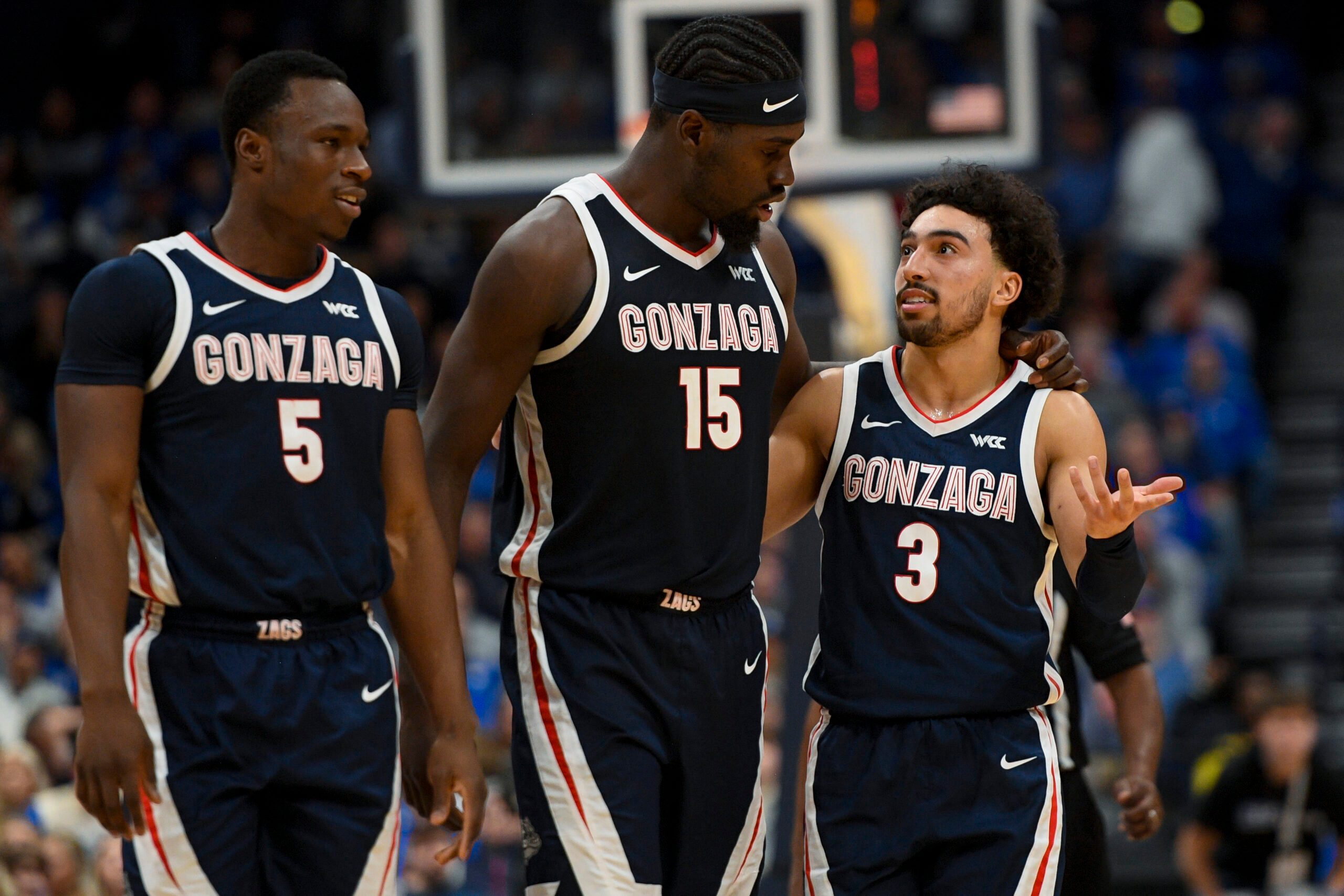 Dec 5, 2025; Nashville, TN, USA;  Gonzaga Bulldogs forward Emmanuel Innocenti (5), forward Graham Ike (15), and guard Braeden Smith (3) walk back to the bench against the Kentucky Wildcats during the first half at Bridgestone Arena. Mandatory Credit: Steve Roberts-Imagn Images