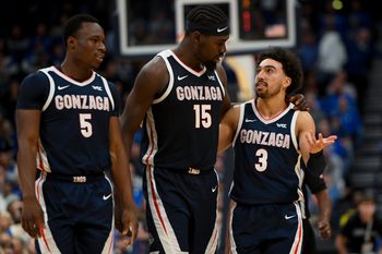 Dec 5, 2025; Nashville, TN, USA;  Gonzaga Bulldogs forward Emmanuel Innocenti (5), forward Graham Ike (15), and guard Braeden Smith (3) walk back to the bench against the Kentucky Wildcats during the first half at Bridgestone Arena. Mandatory Credit: Steve Roberts-Imagn Images