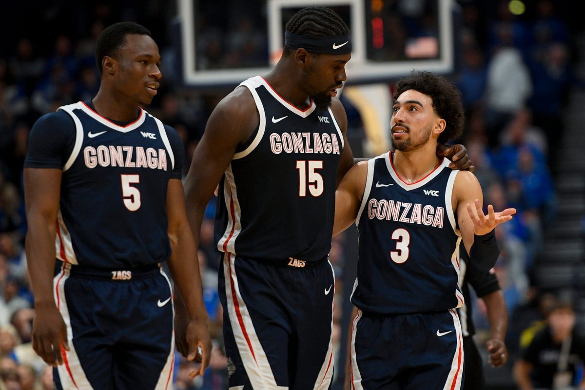 Dec 5, 2025; Nashville, TN, USA; Gonzaga Bulldogs forward Emmanuel Innocenti (5), forward Graham Ike (15), and guard Braeden Smith (3) walk back to the bench against the Kentucky Wildcats during the first half at Bridgestone Arena. Mandatory Credit: Steve Roberts-Imagn Images