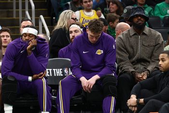 Dec 5, 2025; Boston, Massachusetts, USA; Los Angeles Lakers forward Lebron James (23) sits on the bench in street clothes during the first half against the Boston Celtics at TD Garden. Mandatory Credit: Winslow Townson-Imagn Images