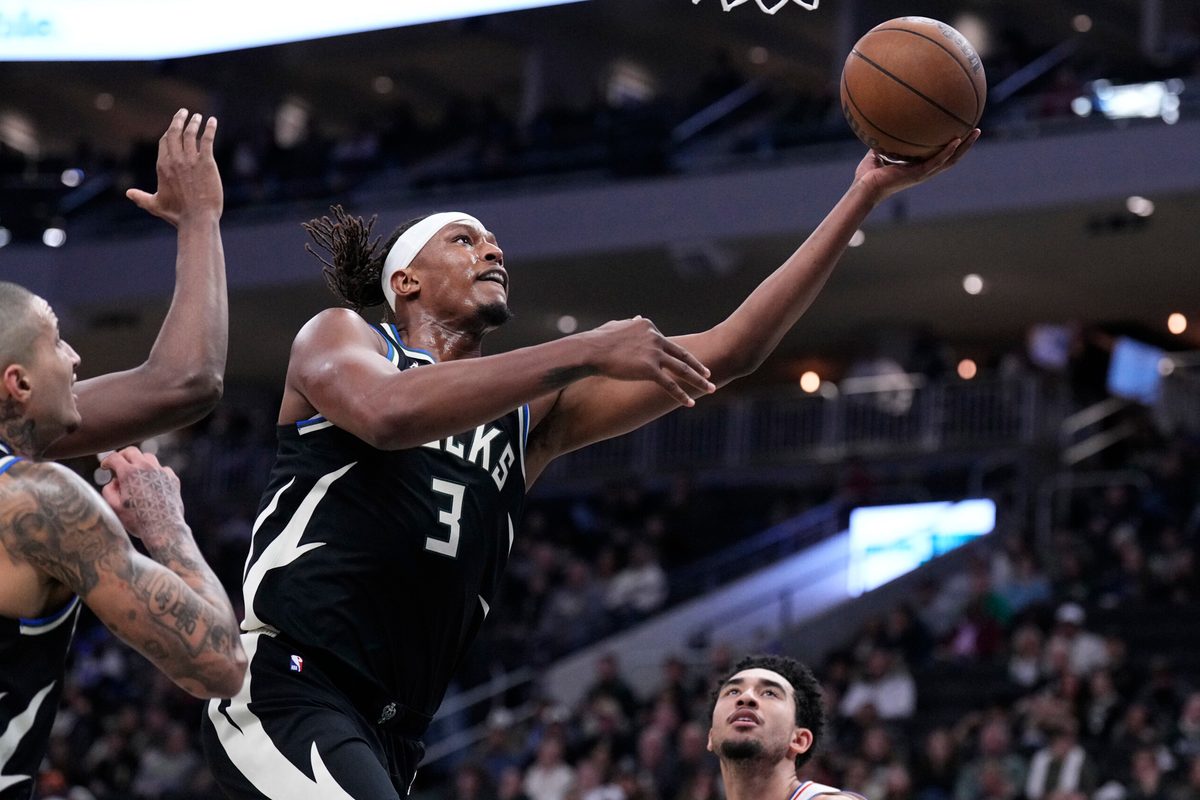 Dec 5, 2025; Milwaukee, Wisconsin, USA; Milwaukee Bucks center Myles Turner (3) lays the ball up for a shot against the Philadelphia 76ers in the first half at Fiserv Forum. Mandatory Credit: Michael McLoone-Imagn Images