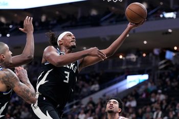 Dec 5, 2025; Milwaukee, Wisconsin, USA; Milwaukee Bucks center Myles Turner (3) lays the ball up for a shot against the Philadelphia 76ers in the first half at Fiserv Forum. Mandatory Credit: Michael McLoone-Imagn Images