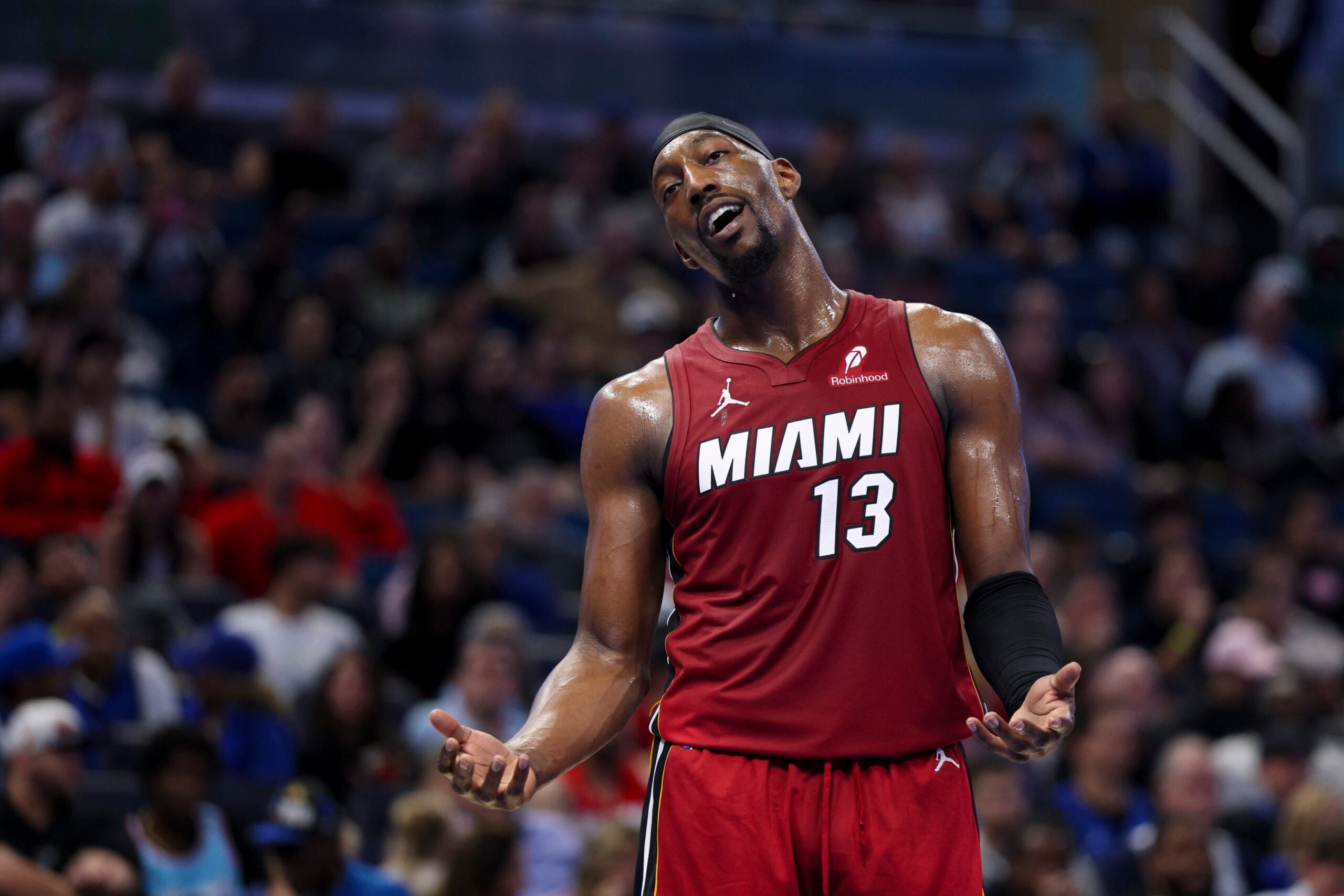 Dec 5, 2025; Orlando, Florida, USA; Miami Heat center Bam Adebayo (13) reacts after a call against the Orlando Magic in the fourth quarter at Kia Center. Mandatory Credit: Nathan Ray Seebeck-Imagn Images