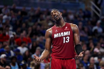 Dec 5, 2025; Orlando, Florida, USA; Miami Heat center Bam Adebayo (13) reacts after a call against the Orlando Magic in the fourth quarter at Kia Center. Mandatory Credit: Nathan Ray Seebeck-Imagn Images