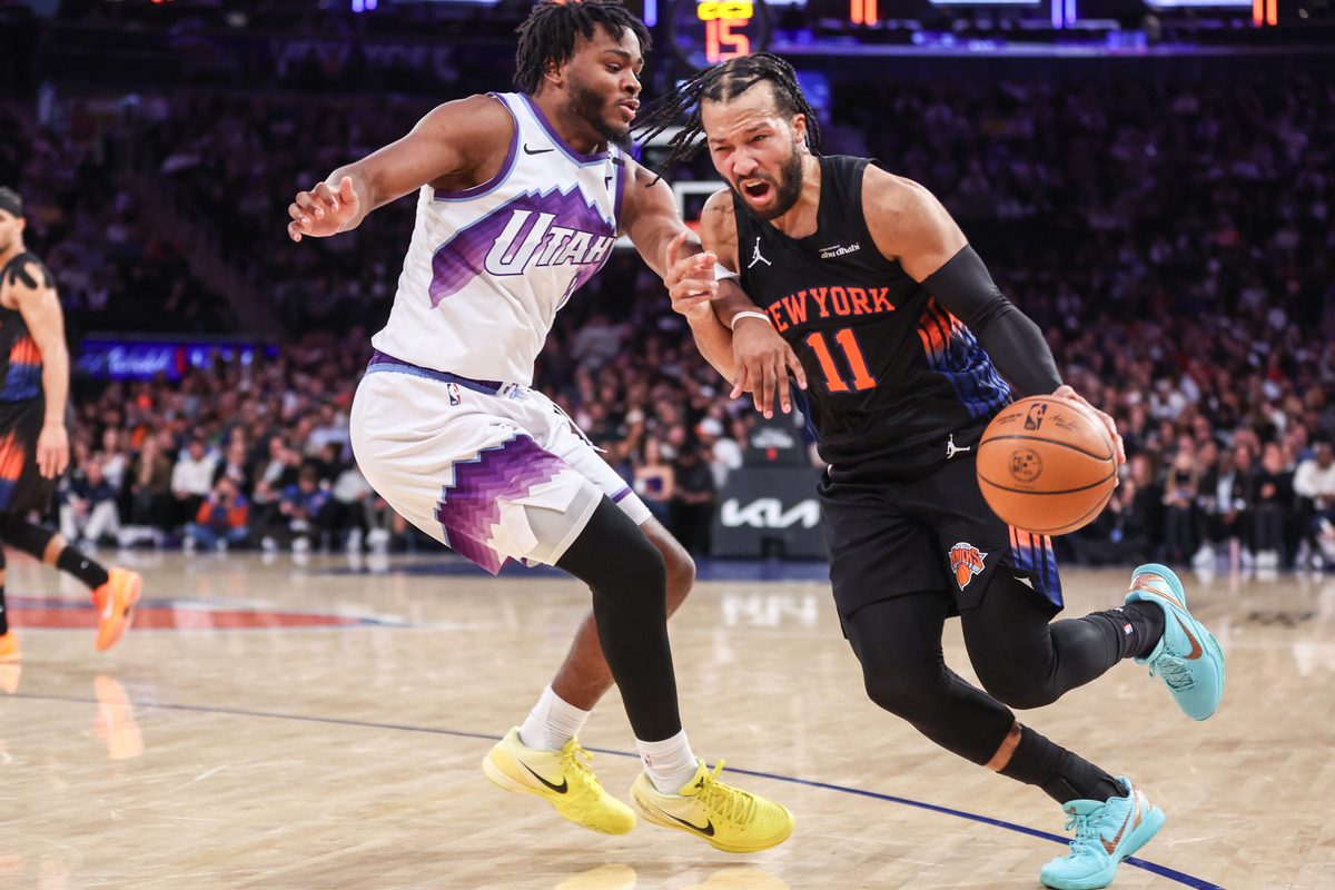 Dec 5, 2025; New York, New York, USA; New York Knicks guard Jalen Brunson (11) looks to drive past Utah Jazz guard Isaiah Collier (8) in the third quarter at Madison Square Garden. Mandatory Credit: Wendell Cruz-Imagn Images