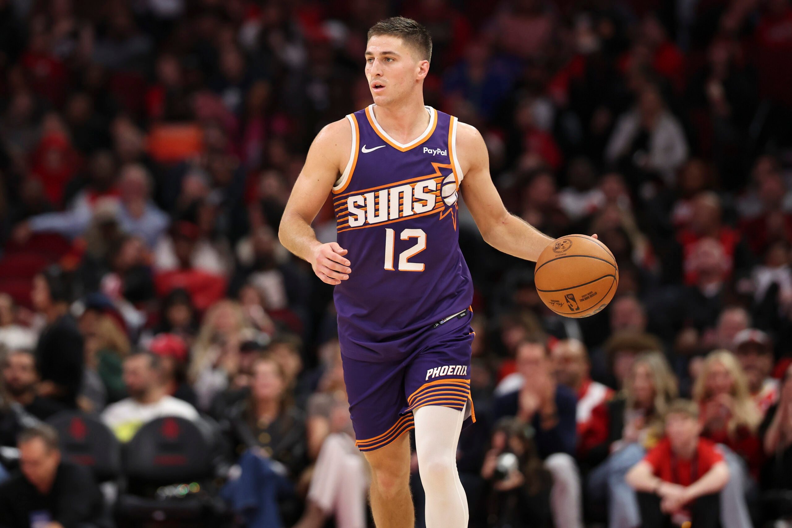 Dec 5, 2025; Houston, Texas, USA; Phoenix Suns guard Collin Gillespie (12) dribbles the ball during the fourth quarter against the Houston Rockets at Toyota Center. Mandatory Credit: Troy Taormina-Imagn Images