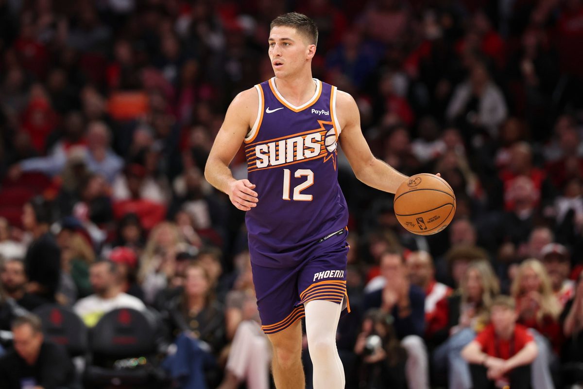 Dec 5, 2025; Houston, Texas, USA; Phoenix Suns guard Collin Gillespie (12) dribbles the ball during the fourth quarter against the Houston Rockets at Toyota Center. Mandatory Credit: Troy Taormina-Imagn Images