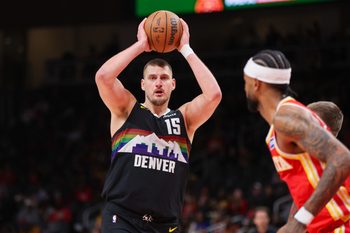 Dec 5, 2025; Atlanta, Georgia, USA; Denver Nuggets center Nikola Jokic (15) handles the ball against the Atlanta Hawks in the fourth quarter at State Farm Arena. Mandatory Credit: Brett Davis-Imagn Images